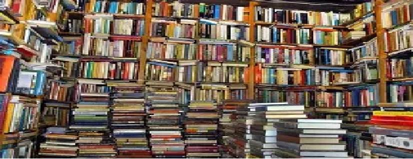 A large pile of books in a library

AI-generated content may be incorrect.