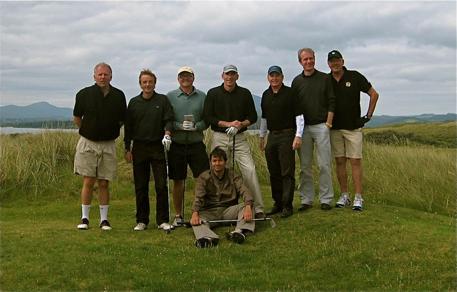 A group of men posing for a photo

Description automatically generated
